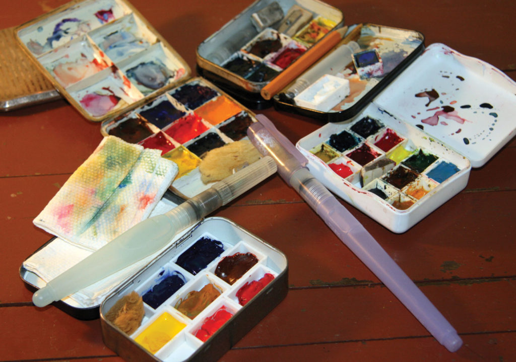 You can make a simple watercolor kit with an empty candy tin or cough drop box and fi ll it with colors of your choice. A watercolor crayon tin also makes a good kit. Use your imagination.