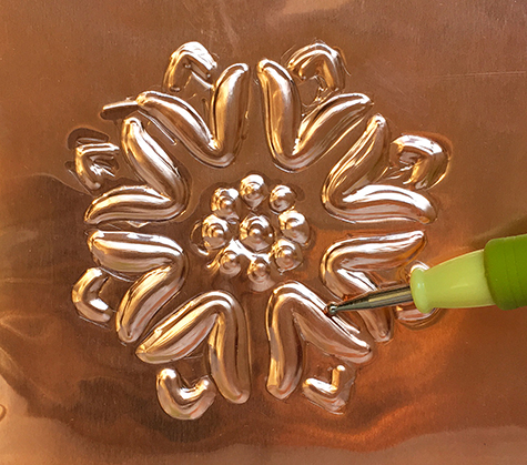Creating defined edges with metal embossing