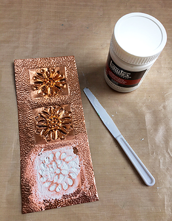 Protecting metal embossing with modeling paste